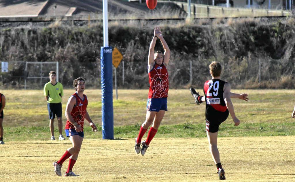 Gavin O’Leary leaps into the air to block the South Toowoomba kick. Gavin O’Leary leaps into the air to block the South Toowoomba kick.